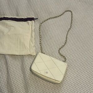 Tory Burch clutch, off white color cross body with adjustable handle.